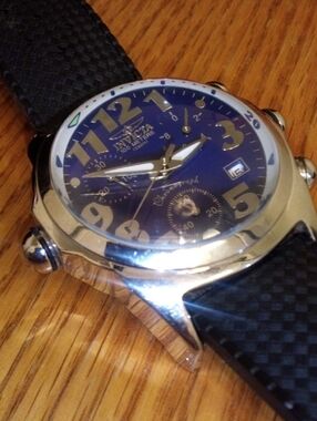 Invicta Blue Dial Watch with Gold Accents and Black Strap